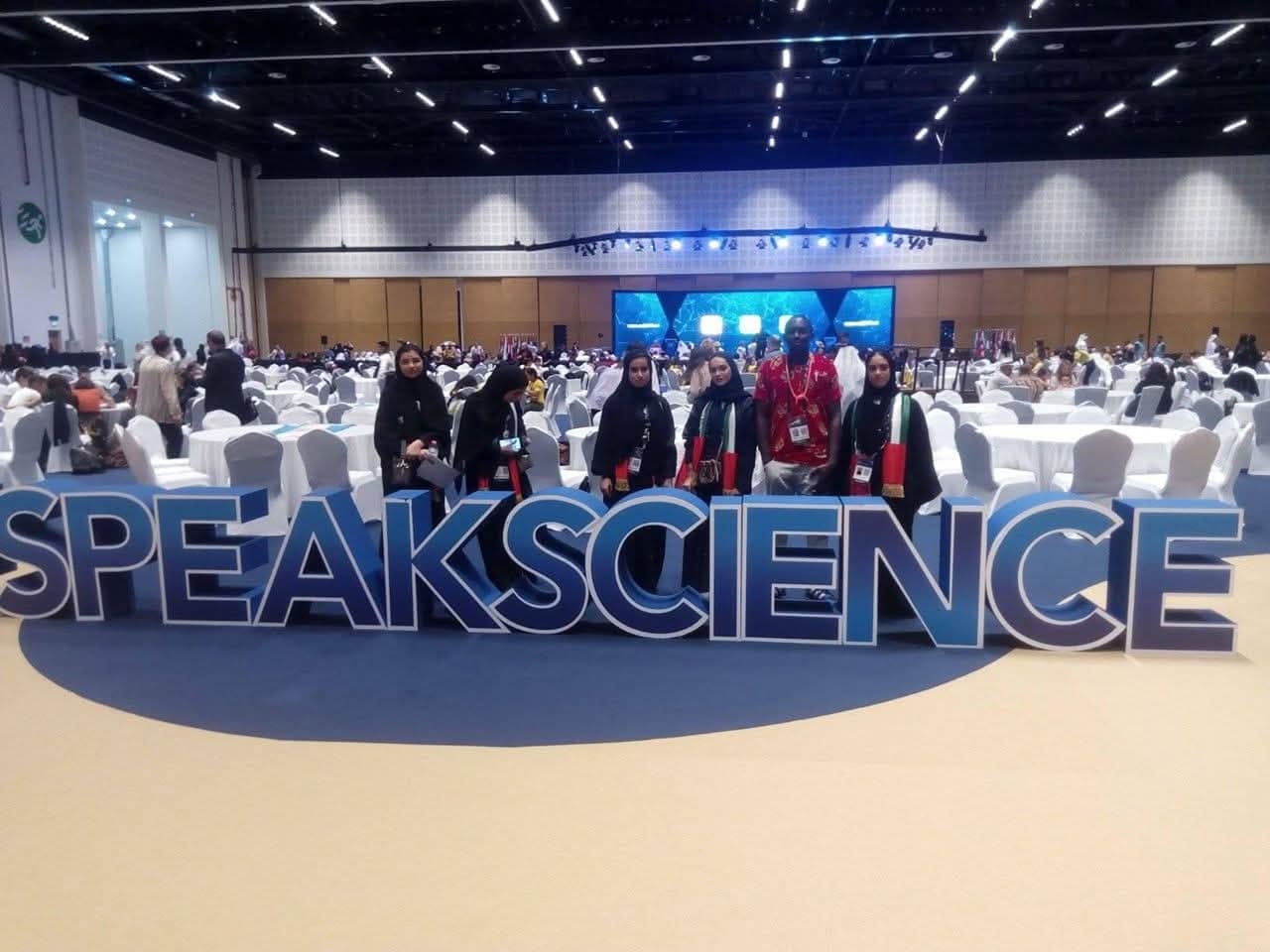 Delegates gathered in front of the large SPEAK SCIENCE lettering in the main exhibition hall.