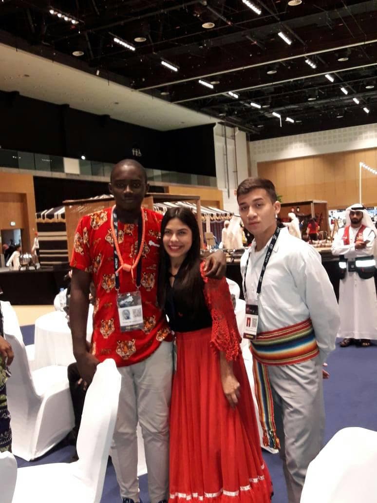With delegates from other national teams, each in their country's traditional dress.