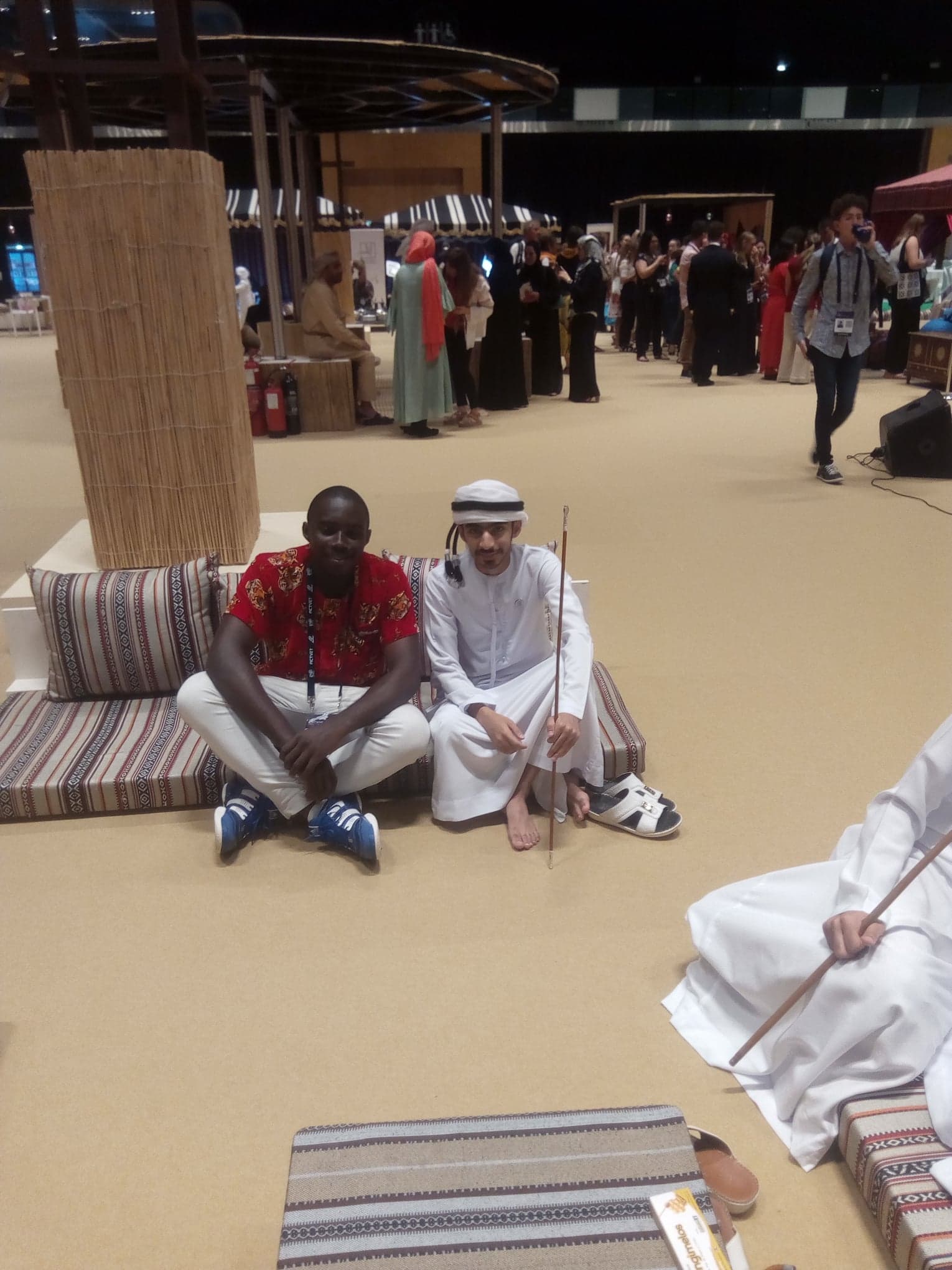 Seated with an Emirati host in the majlis area of the exhibition floor.